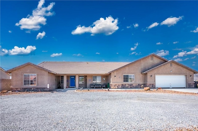 ranch-style house featuring a garage