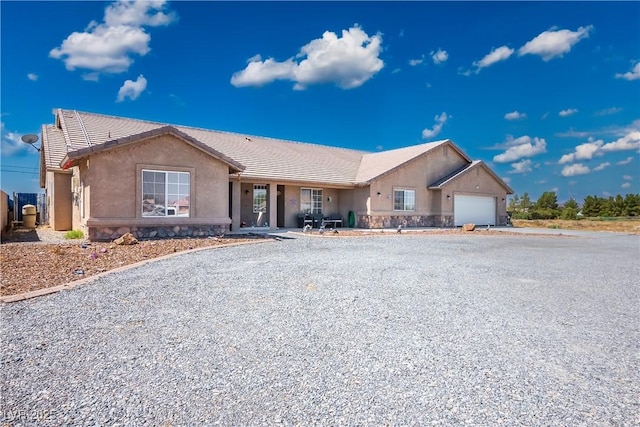 single story home with a garage