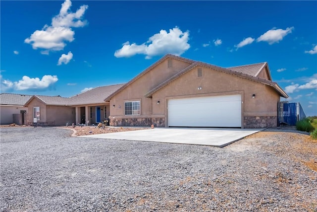 ranch-style home featuring a garage