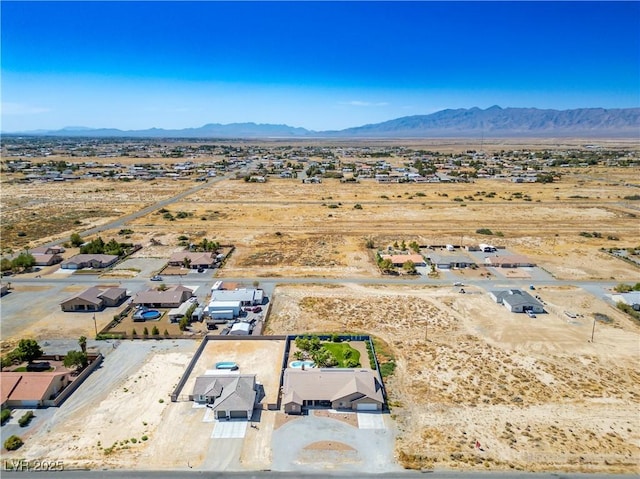 birds eye view of property featuring a mountain view