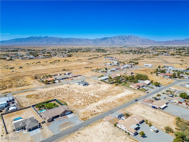 birds eye view of property featuring a mountain view