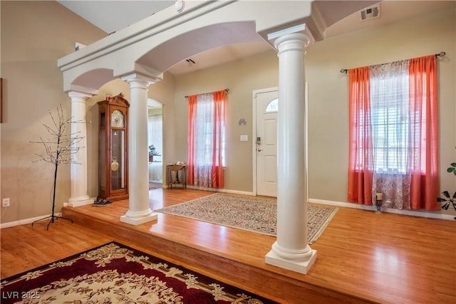 entrance foyer with a healthy amount of sunlight and hardwood / wood-style floors