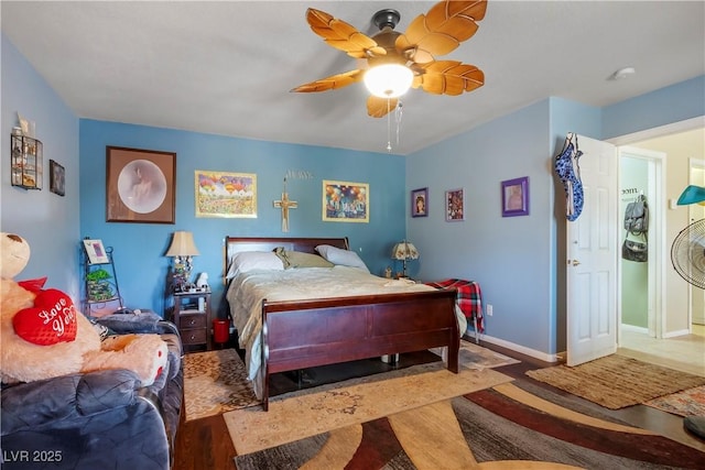 bedroom with ceiling fan and light hardwood / wood-style floors