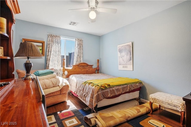 bedroom featuring ceiling fan and dark hardwood / wood-style flooring