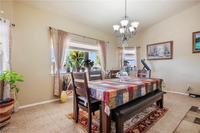 tiled dining area featuring a chandelier