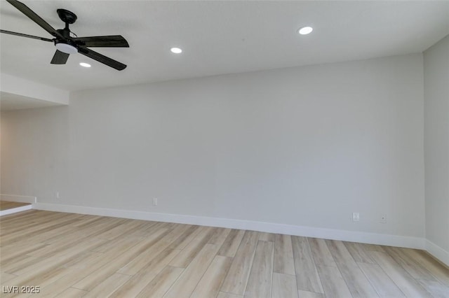 unfurnished room with ceiling fan and light hardwood / wood-style flooring