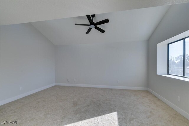 additional living space with light carpet, ceiling fan, and lofted ceiling