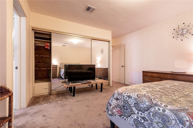 carpeted bedroom featuring a closet