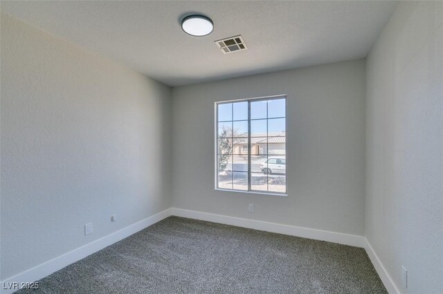 empty room featuring carpet floors