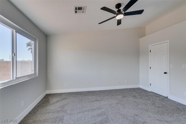 unfurnished room with carpet and ceiling fan