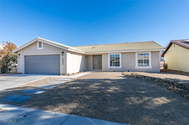 ranch-style home featuring a garage