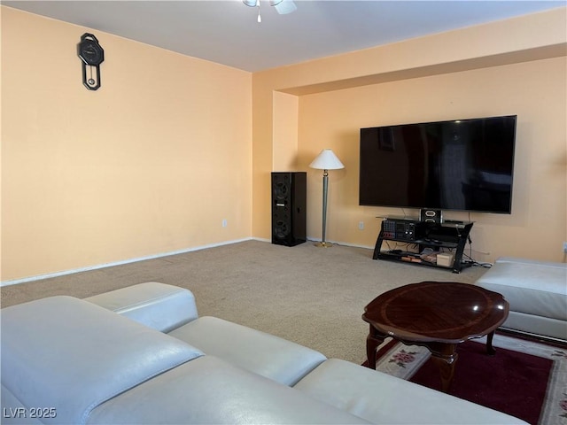 living room with ceiling fan and carpet flooring