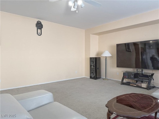 living room with carpet and ceiling fan