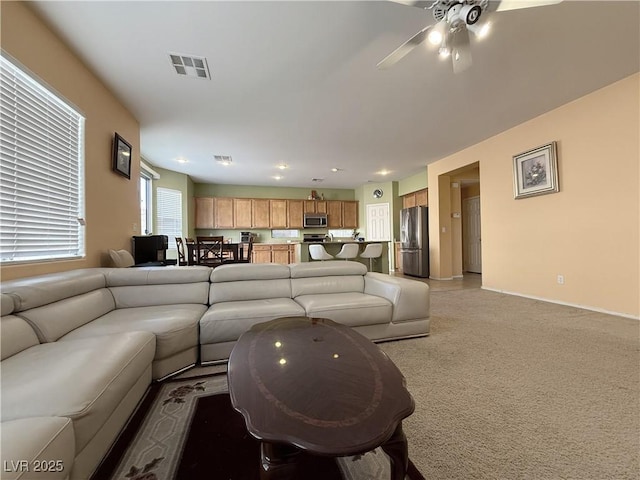 living room with ceiling fan