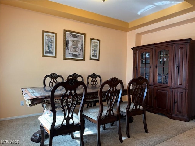 view of carpeted dining area