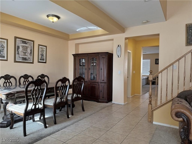 dining space featuring light tile patterned floors