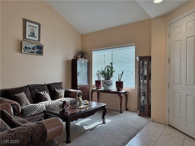 tiled living room featuring lofted ceiling