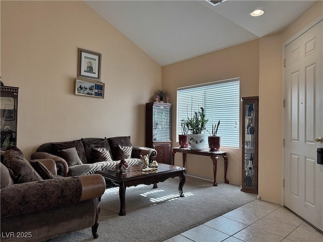 tiled living room featuring vaulted ceiling