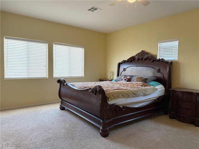 bedroom with ceiling fan and carpet