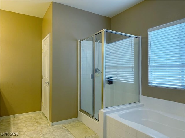 bathroom with tile patterned flooring and plus walk in shower