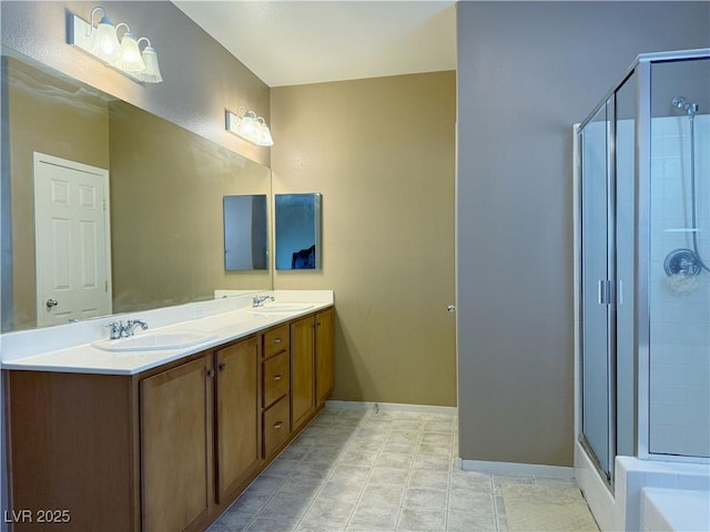 bathroom with vanity and a shower with door