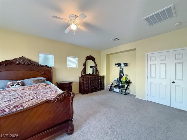 bedroom with ceiling fan, a closet, and carpet floors