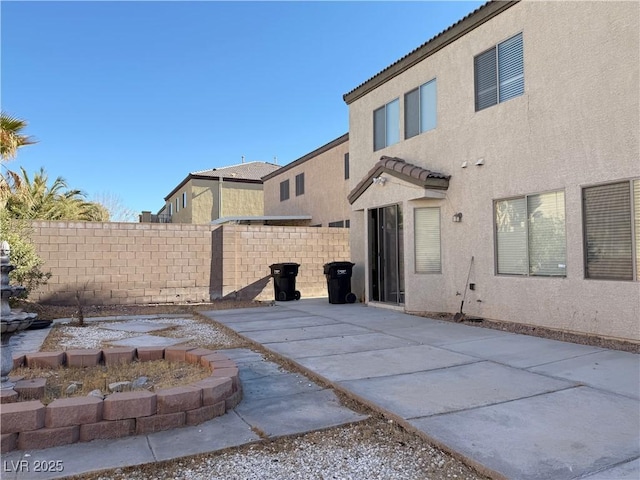 back of house with a patio area