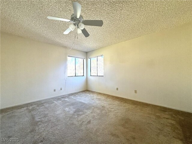 spare room featuring ceiling fan, a textured ceiling, and carpet flooring