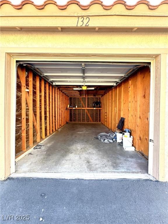 garage featuring wood walls