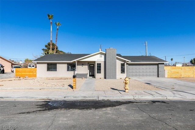 ranch-style home featuring a garage