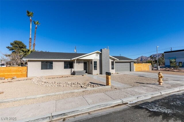 ranch-style home featuring a garage