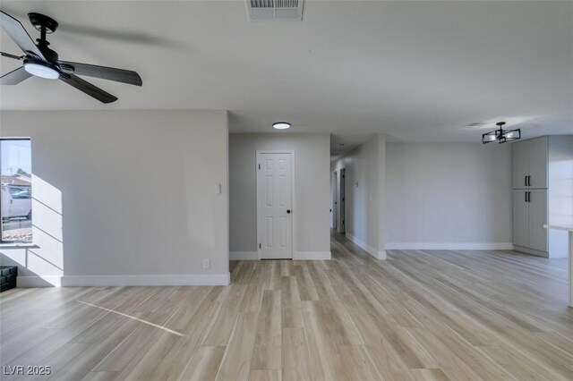 interior space with ceiling fan and light hardwood / wood-style floors