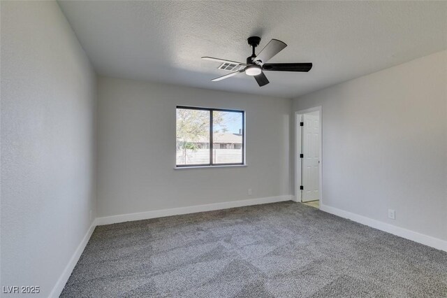 unfurnished room featuring ceiling fan, a textured ceiling, and carpet flooring