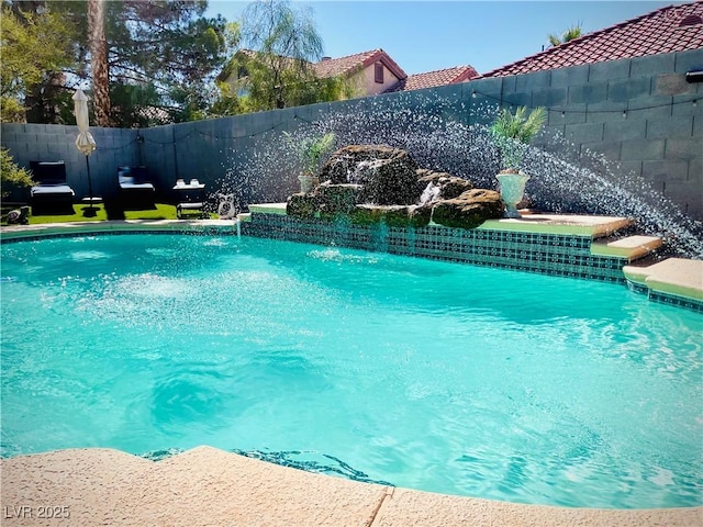 view of swimming pool featuring pool water feature