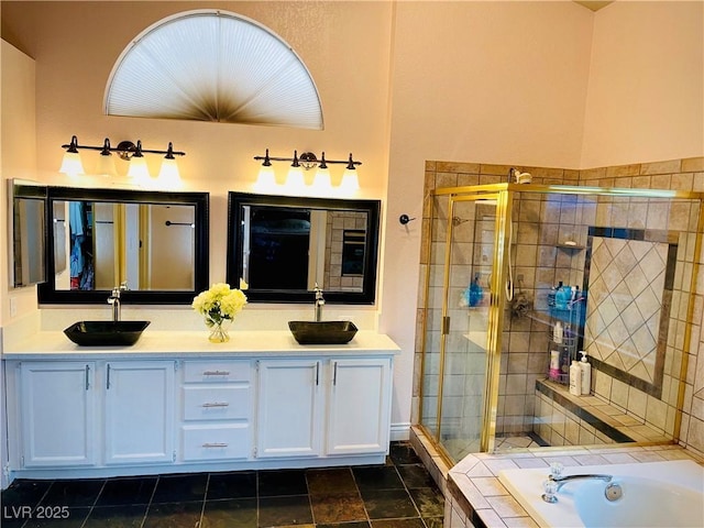 bathroom featuring vanity and shower with separate bathtub