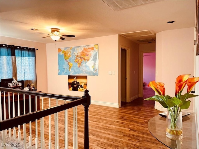 hallway with hardwood / wood-style floors