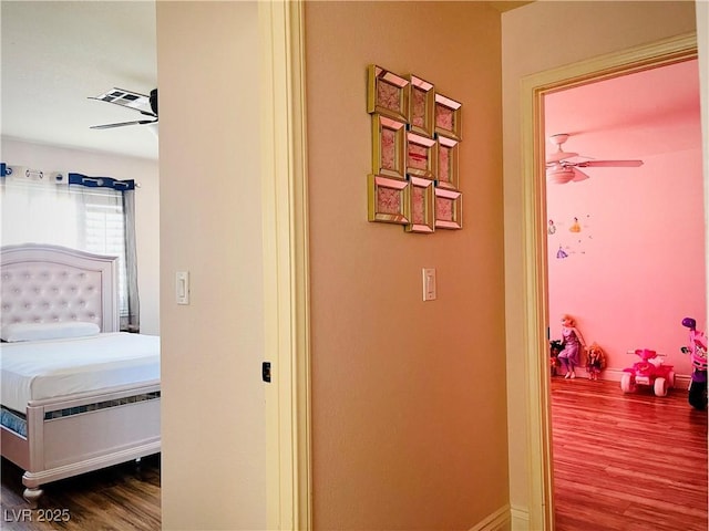 hallway with wood-type flooring