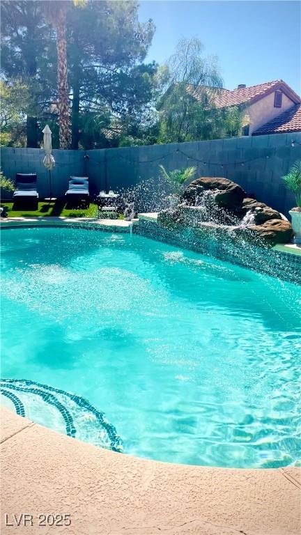 view of pool featuring pool water feature