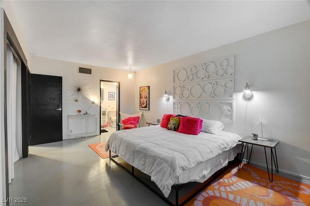 bedroom featuring concrete flooring