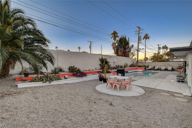 view of yard featuring a fenced in pool and a patio