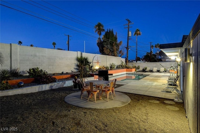 view of patio / terrace featuring a fenced in pool