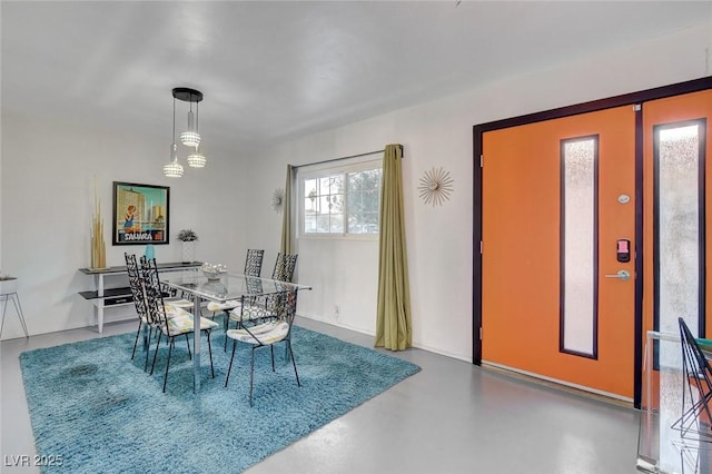 dining room with concrete floors