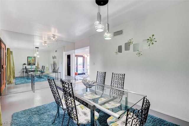 dining room with concrete flooring