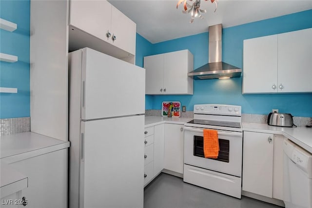 kitchen with white cabinetry, wall chimney range hood, and white appliances