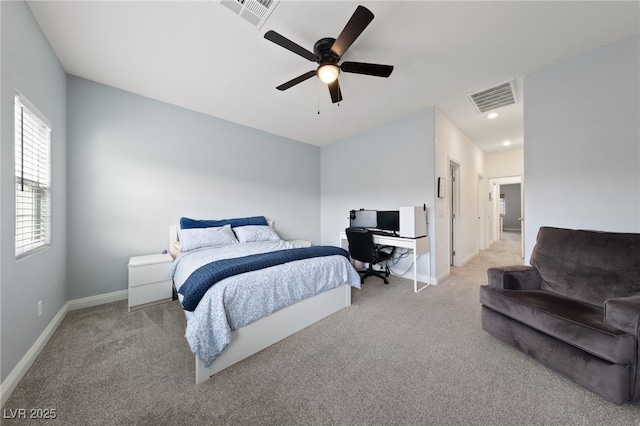 bedroom with ceiling fan and light carpet