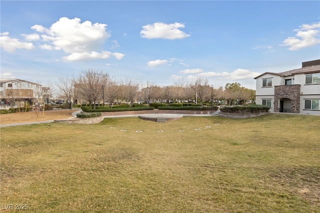 view of home's community featuring a lawn