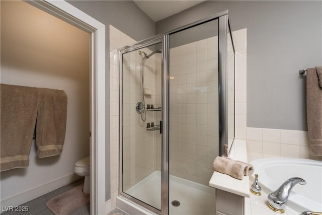 bathroom with toilet and shower with separate bathtub