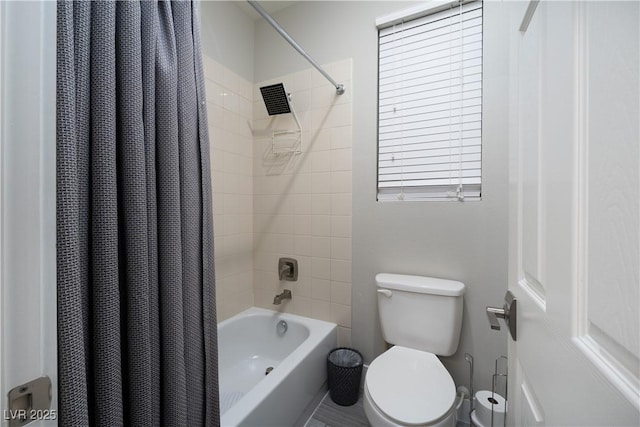 bathroom featuring toilet and shower / bathtub combination with curtain