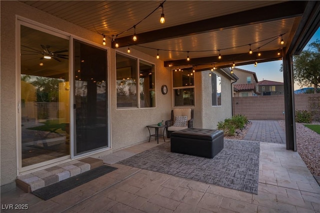 view of patio terrace at dusk