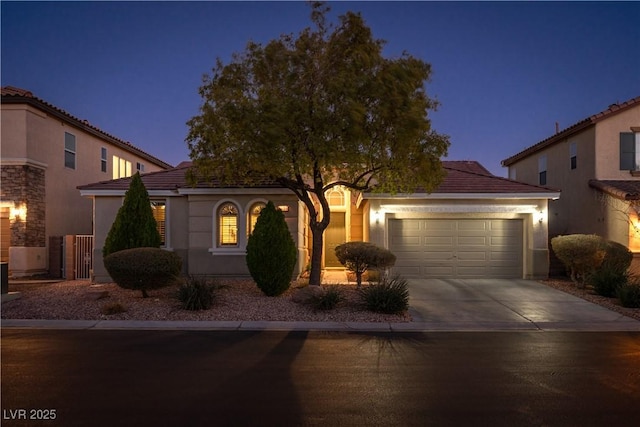 view of front of property with a garage